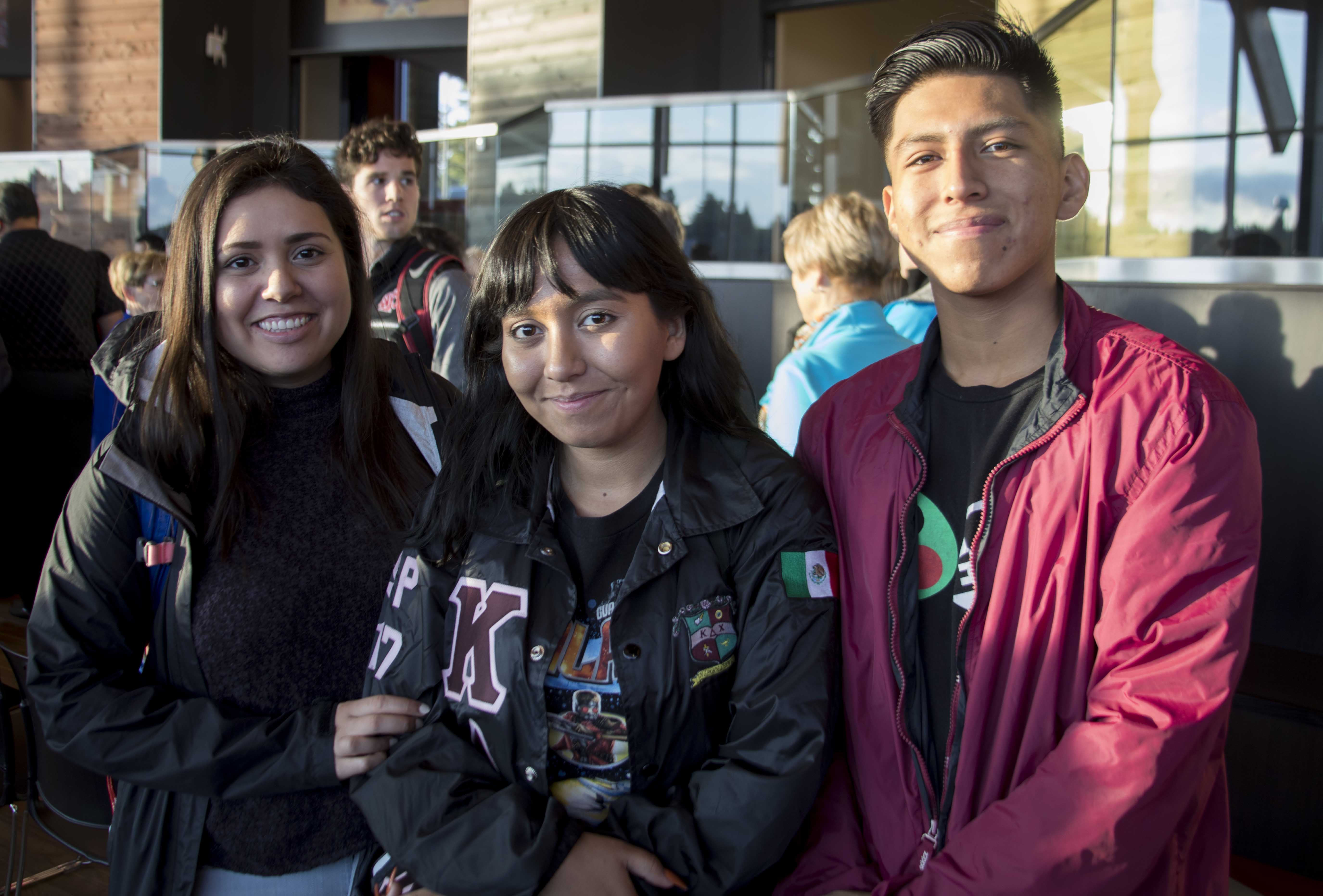 Smiling students looking at the camera during the Cultural Center dedication.