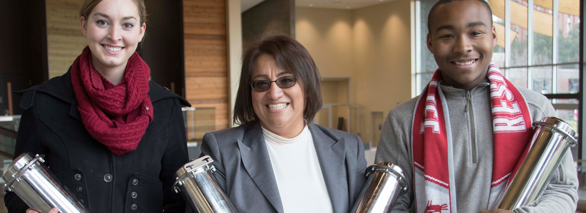 Image of staff and students hold time capsules